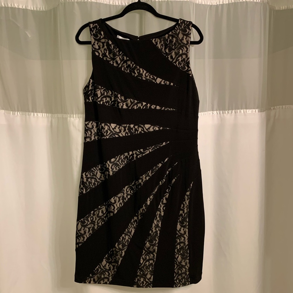 Sleeveless black dress with lace accents